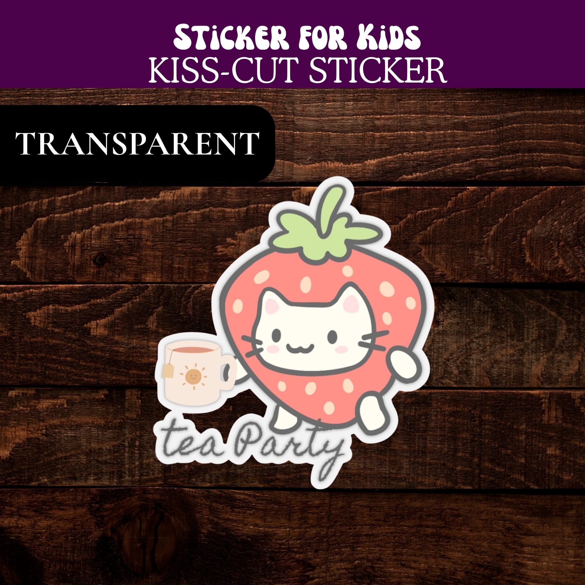 Transparent sticker with a strawberry cat design and 'tea party' text on a wooden background